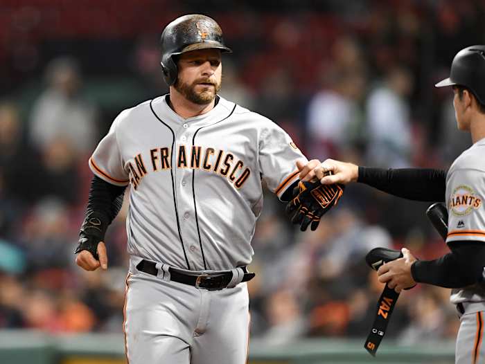 SF Giants catcher Stephen Vogt celebrates with right fielder Mike Yastrzemski after scoring against the Red Sox. (2019)